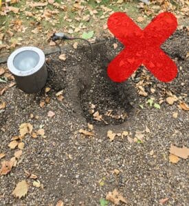 Light and (only) water-resistant junction box sitting in soil
